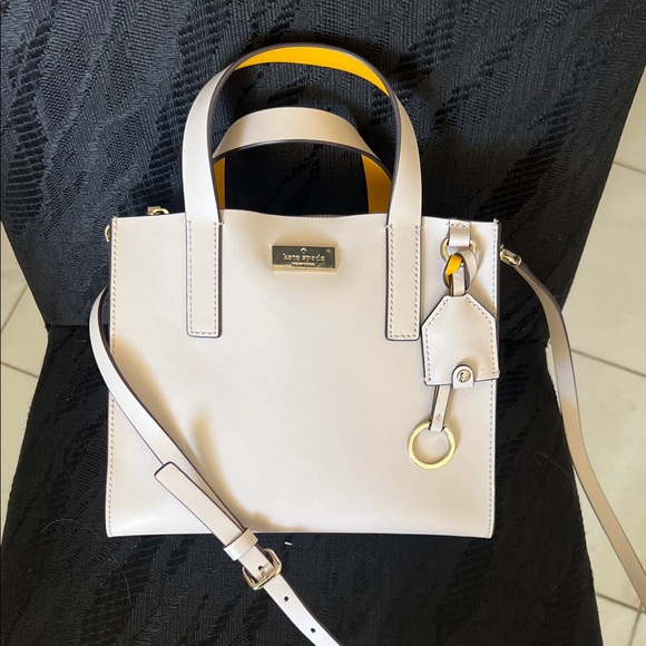kate spade Handbags - Kate Spade Cream Leather Satchel with Yellow Accent